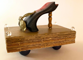 Image of a sculptural collage of objects including wood and beads resembling a high-heeled shoe by artists Beth Smith.